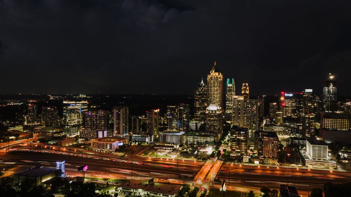 Dense residential condo towers and street life in Midtown Atlanta near Piedmont Park